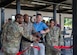 U.S. Air Force Col. Todd E. Randolph, 316th Wing and installation commander, second from left, and members of the 316th Force Support Squadron cut the ribbon during the Toptracer ribbon-cutting event at Joint Base Andrews, Md., June 26, 2024. Toptracer is driving range technology that provides golfers with statistics such as ball speed, apex, curve, and carry. (U.S. Air Force photo by Airman 1st Class Daniel Walderbach)