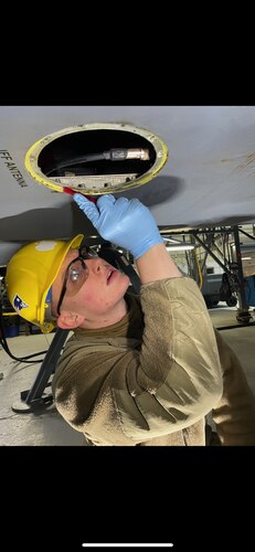 Staff Sgt. Christopher Marion inspects a component on the Identify Friend or Foe system. (U.S. Air Force photo)
