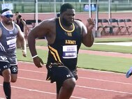 U.S. Army Spc. Darnell Boynton pushes out in front during the track competition