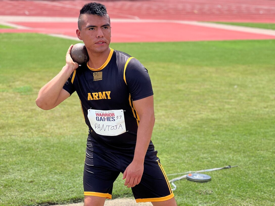 Spc. Alexis Pantoja of Team Army throws in the discus competition