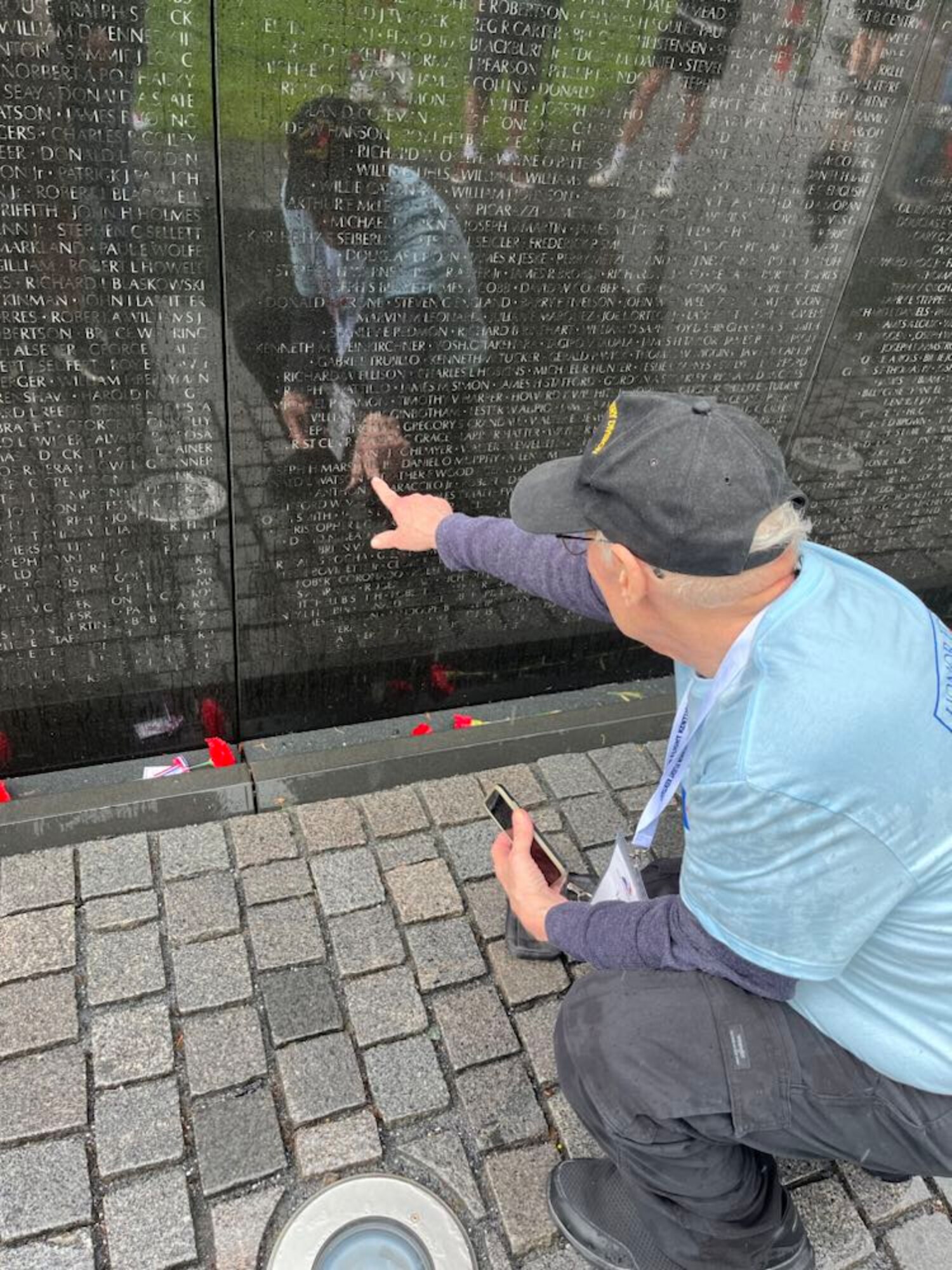 Vietnam veteran Larry Rowe, father of Chief Master Sgt. Robert Rowe, 87th Aerial Port Squadron operations superintendent, visits the Vietnam Veterans Memorial in Washington, May 19, 2024. Both father and son recently took part in the May 19 Honor Flight from Lexington, Kentucky, to Washington. (Courtesy photo)