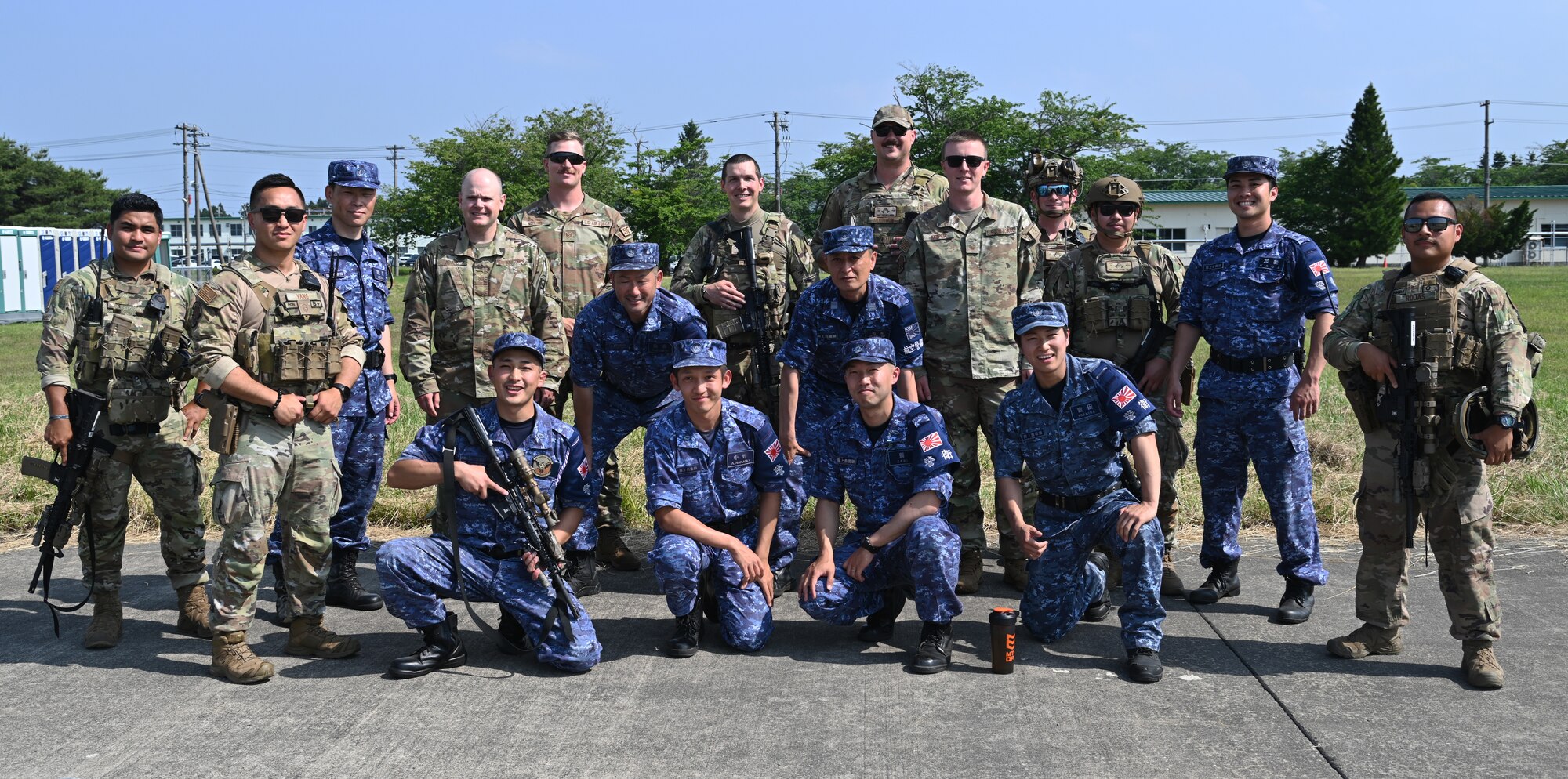 Members from the 721st Contingency Response Squadron and the Japan Maritime Self-Defense Force pose for a photo during Exercise Valiant Shield at Japan Maritime Self-Defense Force Hachinohe Air Base, June 12, 2024.