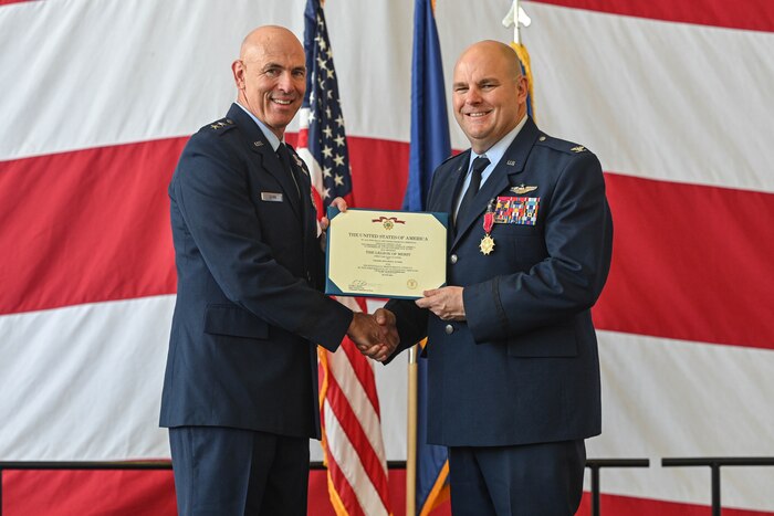 A Major General presents an award to a commander