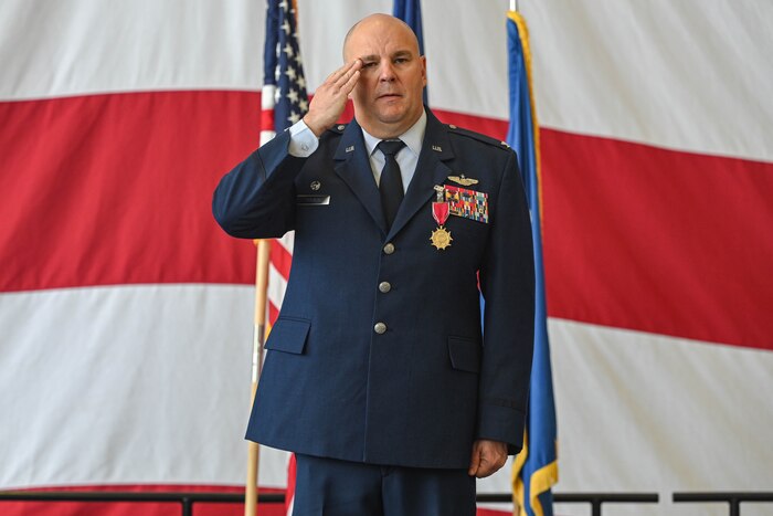 A U.S. Military officer salutes at attention