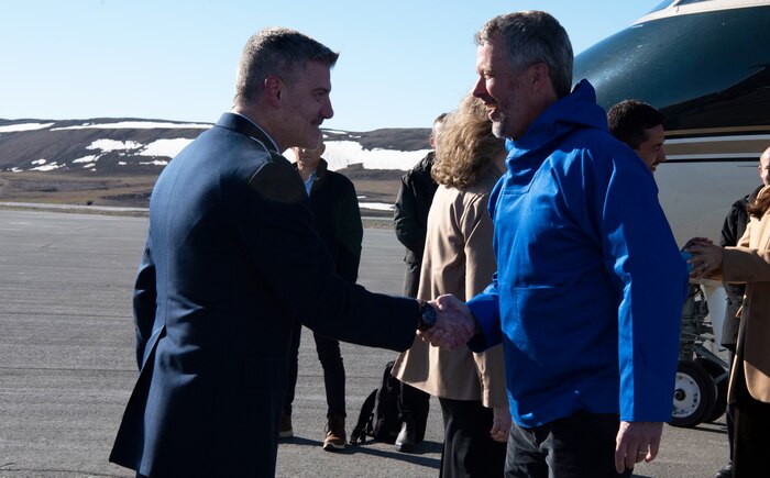 U.S. Space Force Col. Jason Terry, 821st Space Base Group commander, left, shakes the hand of King Frederik X, King of the Kingdom of Denmark, right, after his arrival to Pituffik Space Base, Greenland, June 29, 2024. King Frederik X acceded to the throne of the Kingdom of Denmark January 14, 2024. (U.S. Space Force photo by 1st Lt. Danielle Rose)