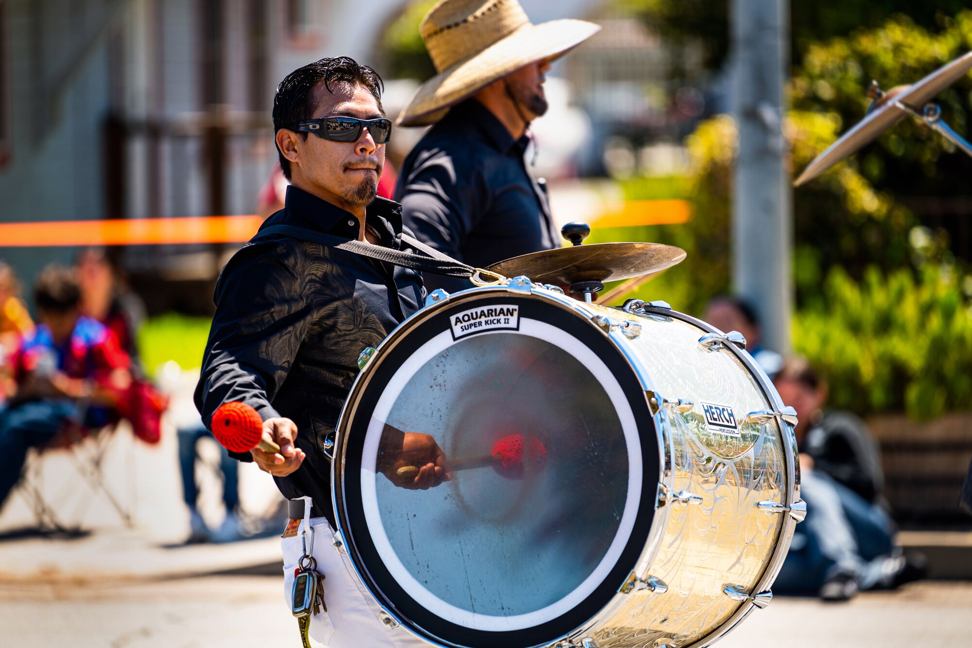 A drummer entertains attendees of a parade during the Lompoc Flower Festival Parade in Lompoc, Calif., June 22, 2024. Leadership from U.S. Space Forces - Space and Space Launch Delta 30 participated in the parade which had over 50 entrees and 500 attendees. (U.S. Space Force photo by Tech. Sgt. Luke Kitterman)