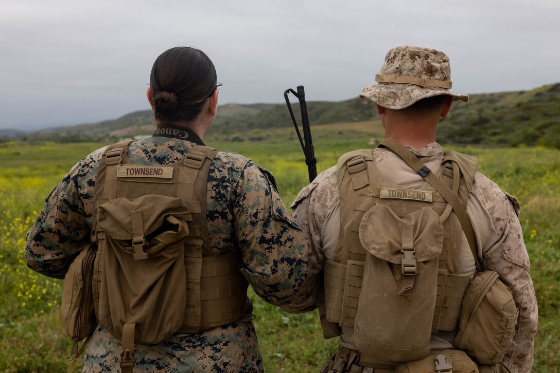 U.S. Marine Corps Cpl. Jaye Townsend, left, a combat videographer with 1st Marine Division, and Sgt. Jack Townsend, a squad leader with 3rd Battalion, 4th Marine Regiment, 1st MARDIV, pose for a photo at Marine Corps Base Camp Pendleton, California, April 23, 2024.