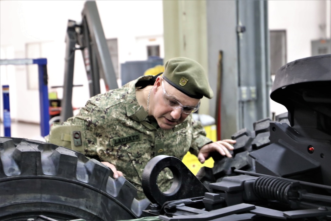 Delegates from the National Army of Uruguay visit Production Plant Barstow, Marine Depot Maintenance Command, as part of the Foreign Military Sales program, to perform joint visual inspections of medium tactical vehicle replacements, June 11 to 14. (United States Marine Corps photo by Betty Jackson, command support at Production Plant Barstow, Marine Depot Maintenance Command)