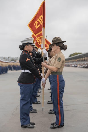 U.S. Marines with Echo Company, 2nd Recruit Training Battalion retire the guidons during a graduation ceremony at Marine Corps Recruit Depot San Diego, California, June 28, 2024. Graduation took place at the completion of the 13-week transformation, which included training for drill, marksmanship, basic combat skills, and Marine Corps customs and traditions. (U.S. Marine Corps photo by Lance Cpl. Alexandra M. Earl)