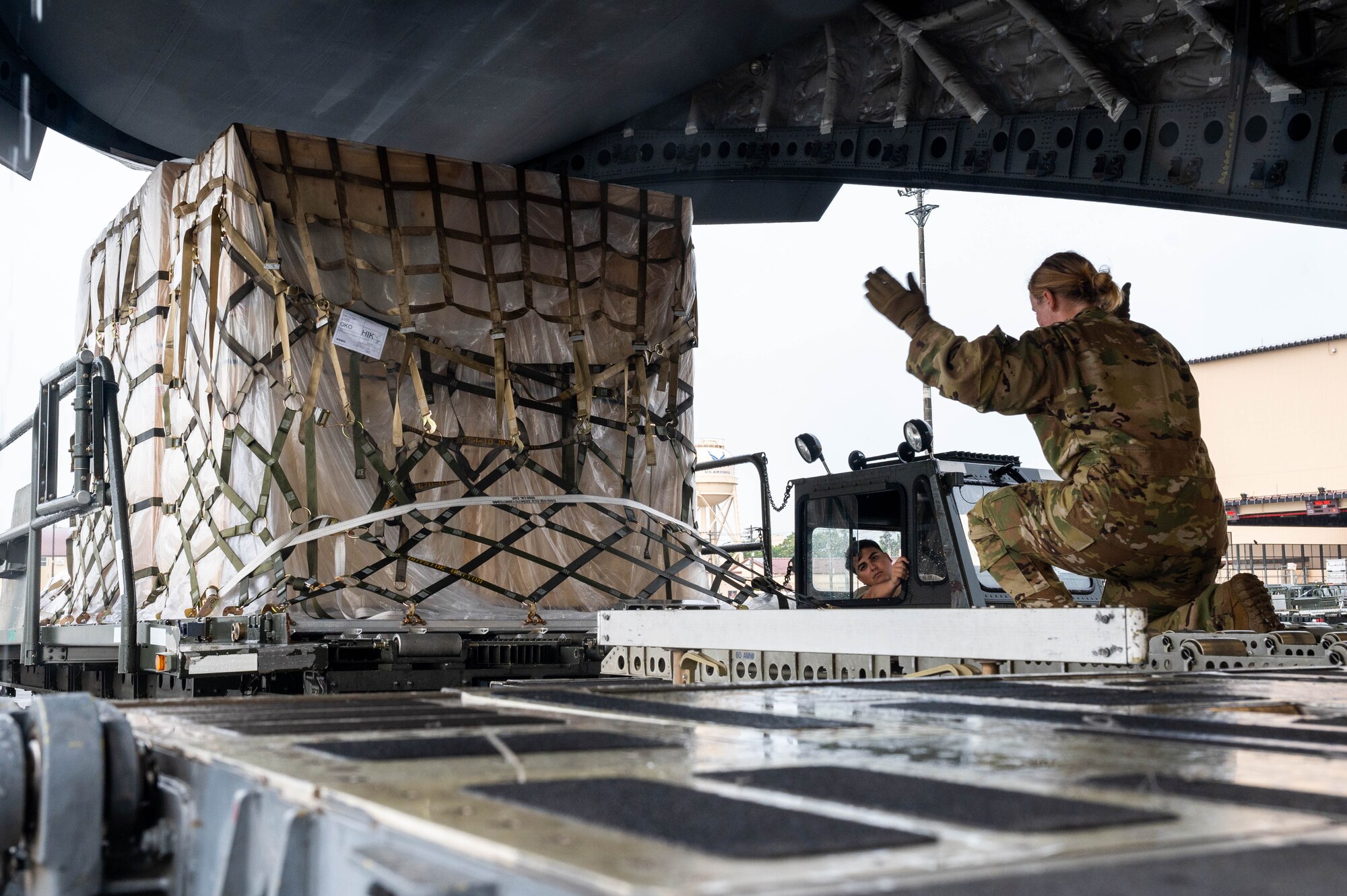 U.S. Air Force Airman 1st Class Aliza Smith, 21st Airlift Squadron, Travis Air Force Base, California loadmaster, directs cargo onto a C-17 Globemaster III out of Travis Air Force Base, California, July 13, 2023, in support of Mobility Guardian 2023. A multilateral endeavor, MG23 features seven participating countries-Australia, Canada, France, Japan, New Zealand, United Kingdom and the United States- operating approximately 70 mobility aircraft across multiple locations spanning a 3,000 miles exercise area from 5 July through 21 July. Our Allies and partners are one of our greatest strengths and a key strategic advantage. MG23 is an opportunity to deepen our connections with regional Allies and partners using bold initiatives.(U.S. Air Force photo by Airman 1st Class Shelby Rapert)