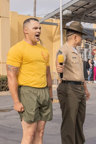 U.S. Marine Corps Staff Sgt. Kyle Huls, drill master, 2nd Recruit Training Battalion, Recruit Training Regiment, says his final order to the Marines of Echo Company, 2nd Recruit Training Battalion, during a motivational run at Marine Corps Recruit Depot San Diego, California, June 27, 2024. The company motivational run is a three-mile cadence run conducted around the Depot, the last physical training event the Marines will conduct before they graduate from MCRD San Diego, and the first time their friends and families will see their newly transformed U.S. Marines. Huls served as the 2nd Recruit Training Battalion drill master from July 2023 to July 2024 and passed the position over to Staff Sgt. Logan E. Stogdill. (U.S. Marine Corps photo by Lance Cpl. Alexandra M. Earl)