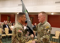 Cyber Center of Excellence Commanding General, Maj. Gen. Paul Stanton passes the Cyber School's guidon to Col. John J. Hosey Jr becoming the 6th Chief of Cyber.