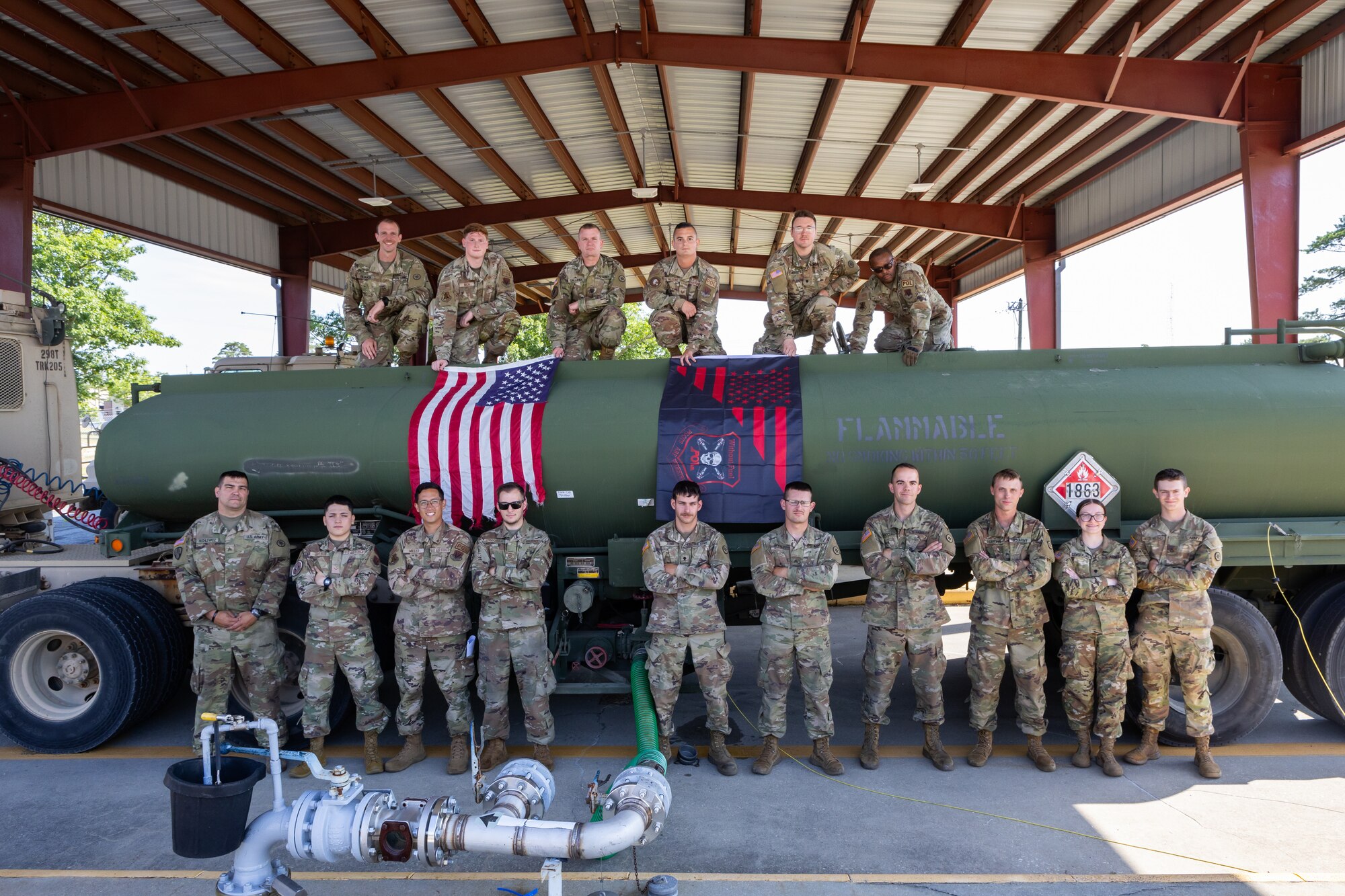 U.S. Army Soldiers assigned to the 298th Transportation Company, Franklin United States Army Reserve Center, Franklin, Pennsylvania, operating out of Joint Base McGuire, Dix, Lakehurst (JB M-D-L), New Jersey, 177th Logistics Readiness Squadron Petroleum, Oil, and Lubricants Flight Airmen and a Multi-Capable Airman (MCA), pose for a group photograph at the 177th Fighter Wing, Egg Harbor Township, June 12, 2024.