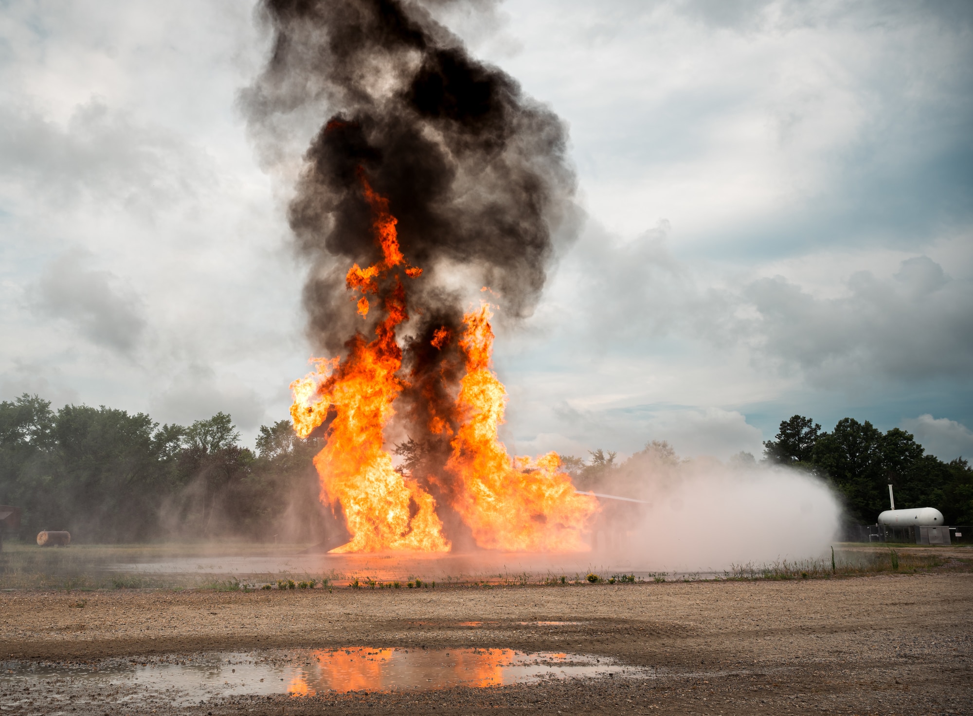 An aircraft trainer is ablaze during a fire exercise
