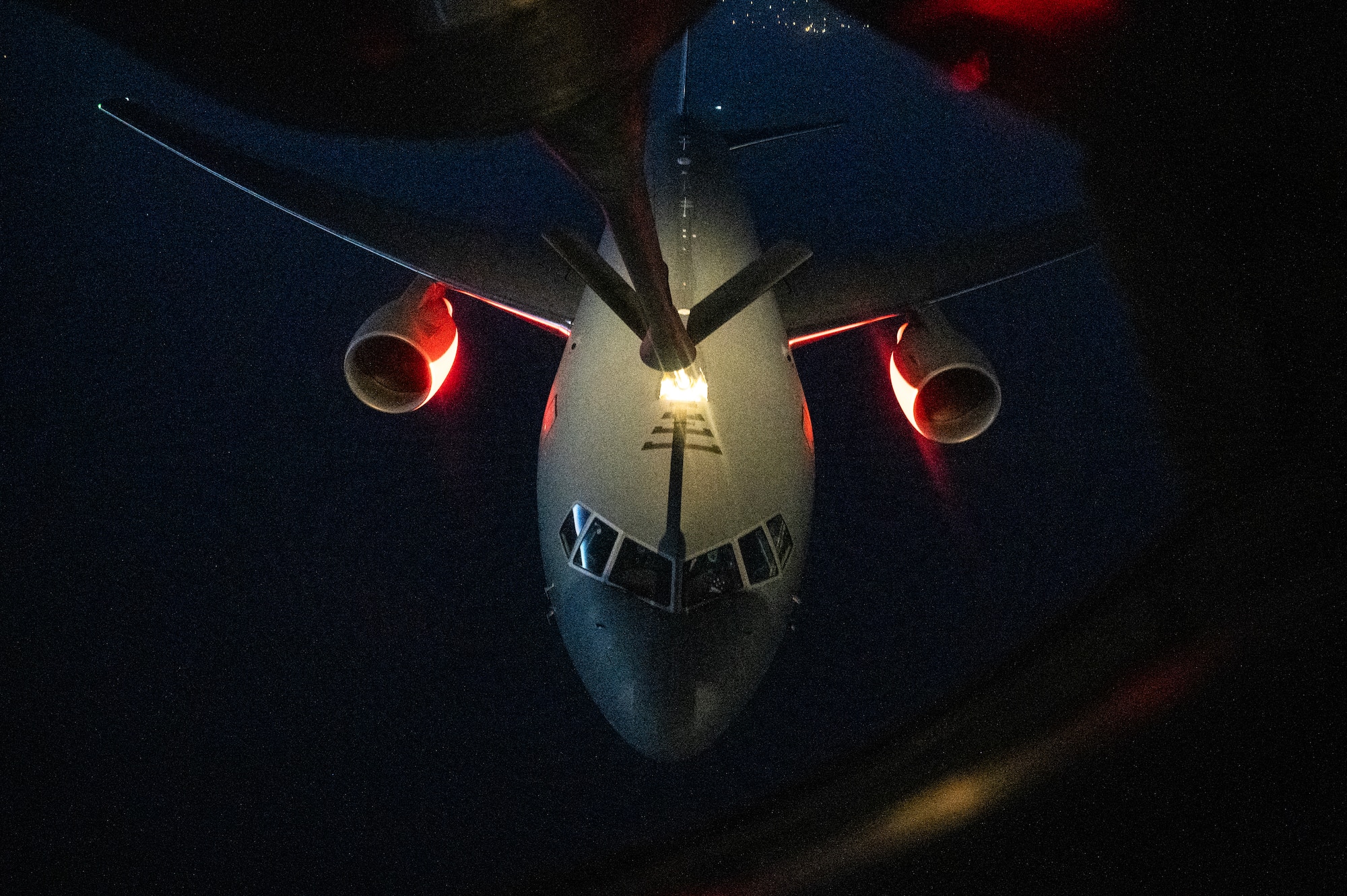 A U.S. Air Force KC-46 Pegasus from McConnell Air Force Base's 22nd Air Refueling Wing, receives fuel from a KC-135 Stratotanker from McConnell Air Force Base's 350th Expeditionary Air Refueling Squadron, over the U.S. Central Command area of responsibility, July 1, 2024. The KC-46 is participating in Project Magellan, a 43-hour long max endurance mission, circumnavigating the globe. The mission is the longest sortie in AMC History and the longest combat sortie in history. (U.S. Air Force photo)