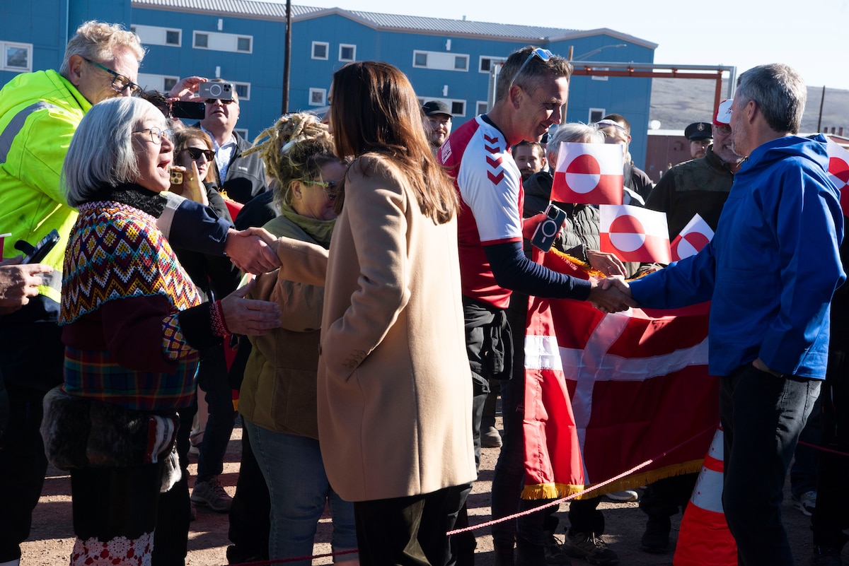 Queen Mary, Queen of the Kingdom of Denmark, left, and King Frederik X, King of the Kingdom of Denmark, right, shake hands with Greenlanders and Pituffik Space Base personnel at Pituffik SB, Greenland, June 29, 2024. King Frederik X and wife Queen Mary made a stop to Pituffik SB while on their way to the village of Qaanaaq. (U.S. Space Force photo by 1st Lt. Danielle Rose)