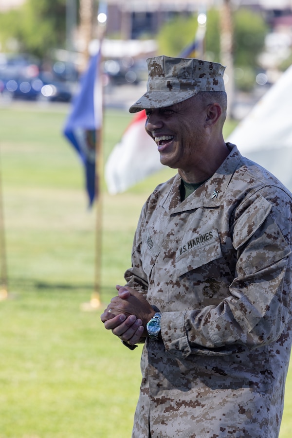 U.S. Marine Corps Col. Leonel Brito Jr., a Manhattan, New York native, oncoming commanding officer of Marine Corps Logistics and Operations Group, Marine Air-Ground Task Force Training Command, Marine Corps Air-Ground Combat Center, gives a speech during a change of command ceremony at Lance Corporal Torrey Grey Field, MCAGCC, Twentynine Palms, California, June 21, 2024. The change of command ceremony represents the official passing of command from Reynolds to Brito. (U.S. Marine Corps photo by Lance Cpl. Anna Higman)