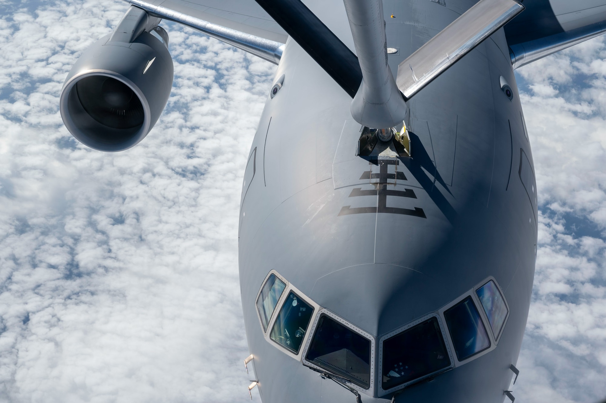 A 350th Air Refueling Squadron KC-135R Stratotanker from McConnell Air Force Base, Kansas, refuels a McConnell KC-46A Pegasus over the United Kingdom, July 1, 2024. The KC-46 was taking part in a 45-hour Maximum Endurance Operation, called Project Magellan, launching June 29 from McConnell Air Force Base, flying westward, non-stop, around the world and landing back at McConnell July 1.  (U.S. Air Force photo by Airman 1st Class Gavin Hameed)