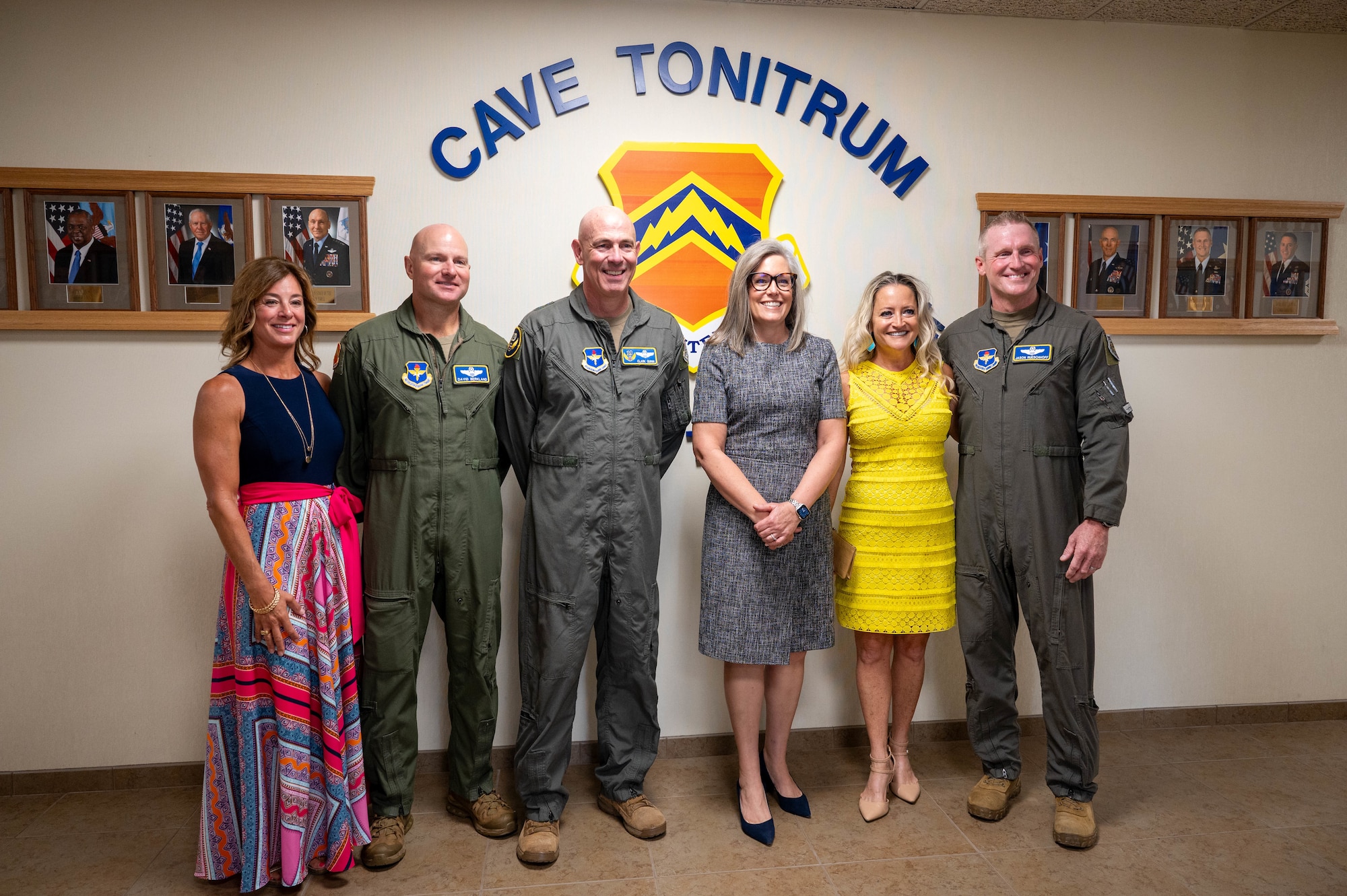 Arizona Governor Katie Hobbs (center right) stands alongside U.S. Air Force Maj. Gen. Clark Quinn (center left), 19th Air Force commander, Brig. Gen. Jason Rueschhoff (far right), 56th Fighter Wing outgoing commander, his wife Melissa Rueschhoff (second from right), Col. David Berkland (second from left), incoming 56th FW commander, and his wife Nikki Berkland (far left), for a group photo, July 1, 2024, at Luke Air Force Base, Arizona.