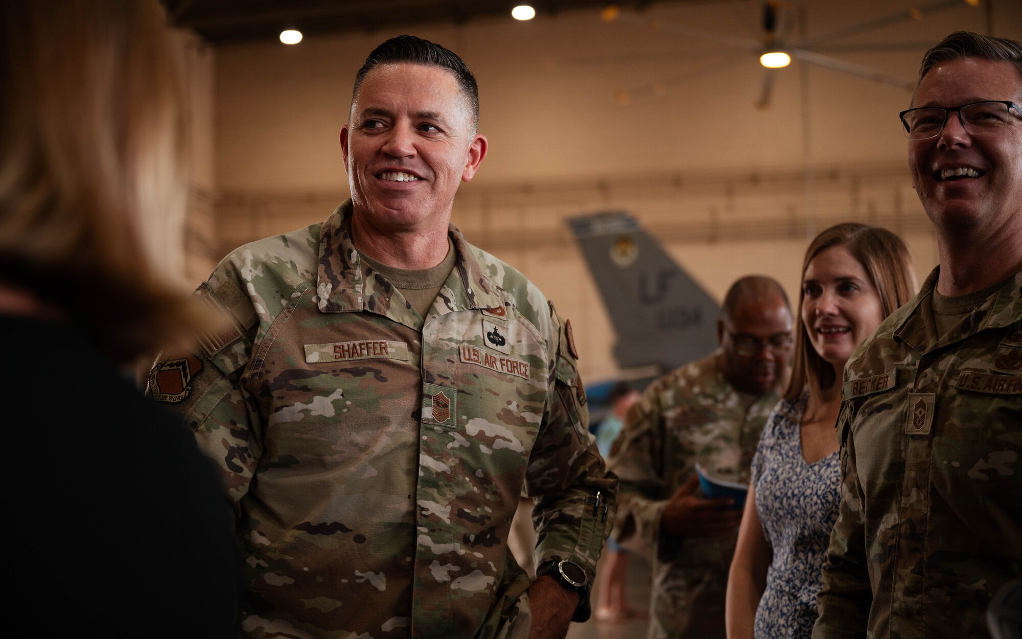 U.S. Air Force Chief Master Sgt. Jason Shaffer (left), 56th Fighter Wing command chief, visits with Chief Master Sgt. Michael Becker (right), 355th Wing command chief, at the 56th FW Change of Command ceremony, July 1, 2024, at Luke Air Force Base, Arizona.
