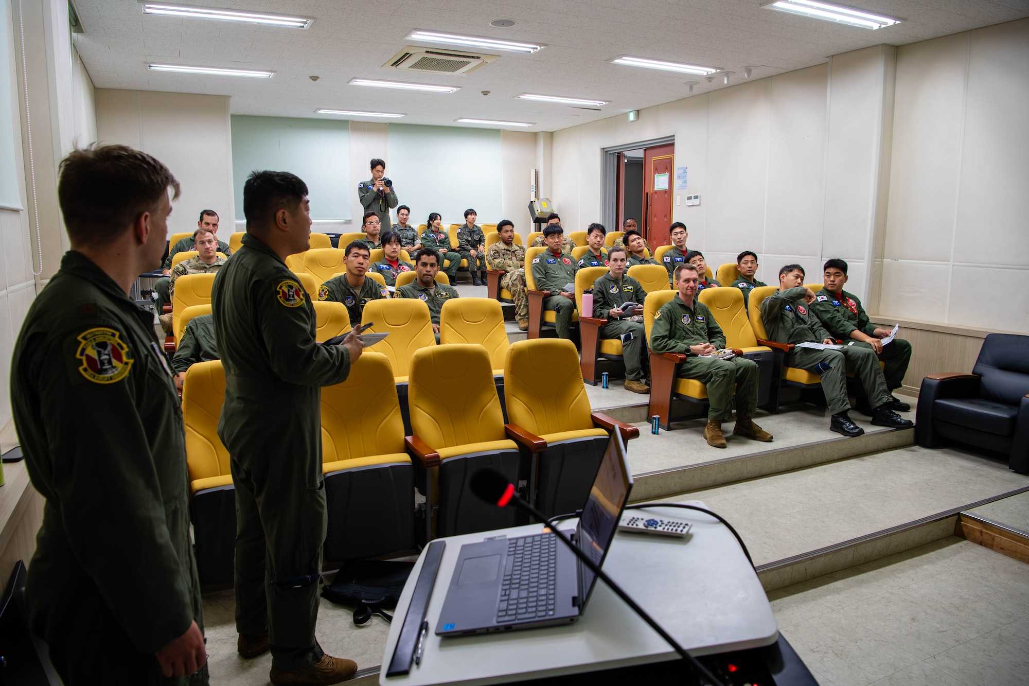 Members of the U.S. Air Force and Republic of Korea Air Force discuss the details of an airdrop training event during a briefing at Gimhae Air Base, Republic of Korea.