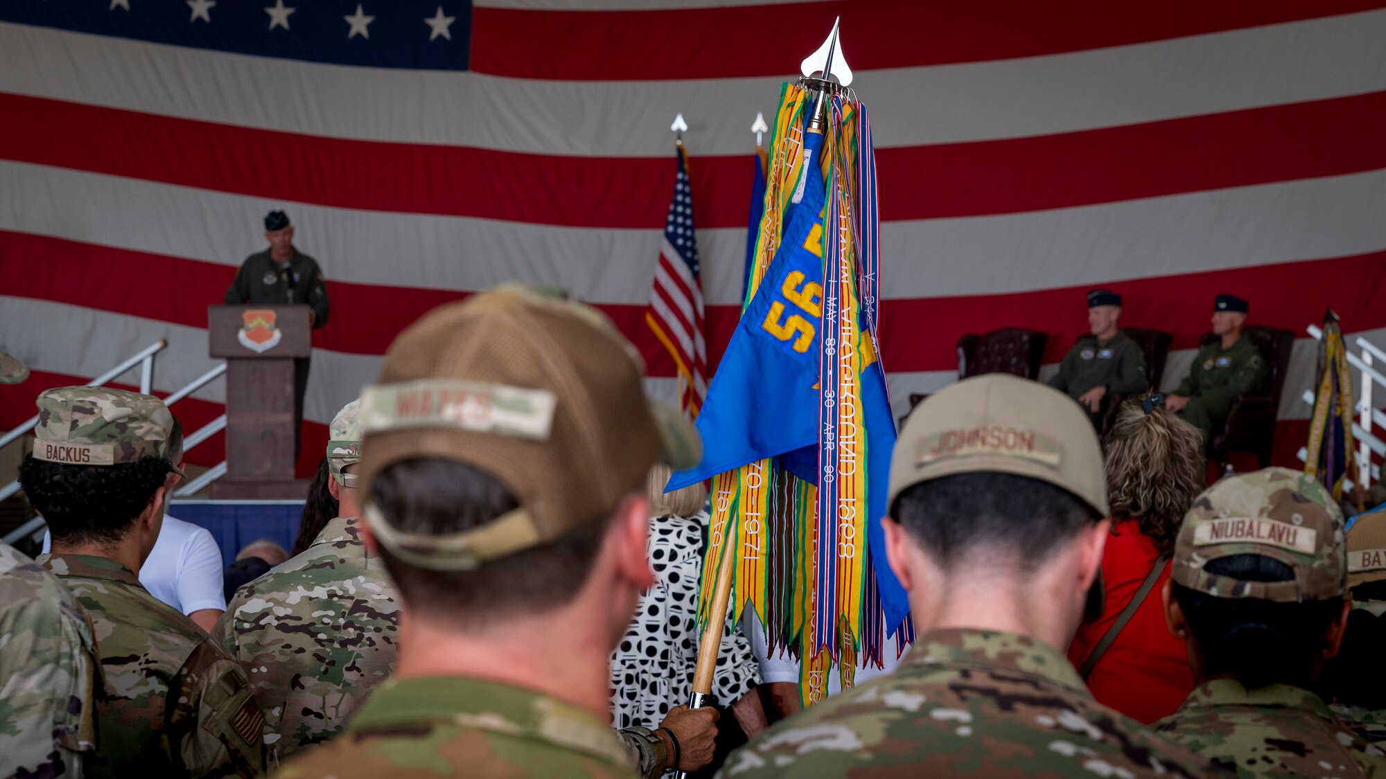 A U.S. Air Force Airman holds a guidon during the 56th Fighter Wing Change of Command ceremony, July 1, 2024, at Luke Air Force Base, Arizona.