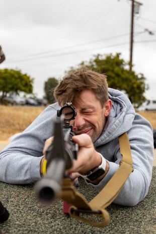 Shawn Woods, a high school mathematics teacher at Andover High School, Andover, Kan., sights in with a rifle as a part of a weapons familiarization drill as a part of the 2024 Educators' Workshop at Marine Corps Base Camp Pendleton, Calif., June 19, 2024. Participants of the workshop visited MCRD San Diego and other local bases to observe recruit training and gain a better understanding about the transformation from recruits to United States Marines. Educators also received classes and briefs on the benefits that are provided to service members serving in the U.S. Armed Forces. (U.S. Marine Corps photo by Sgt. Lennon Dregoiw)