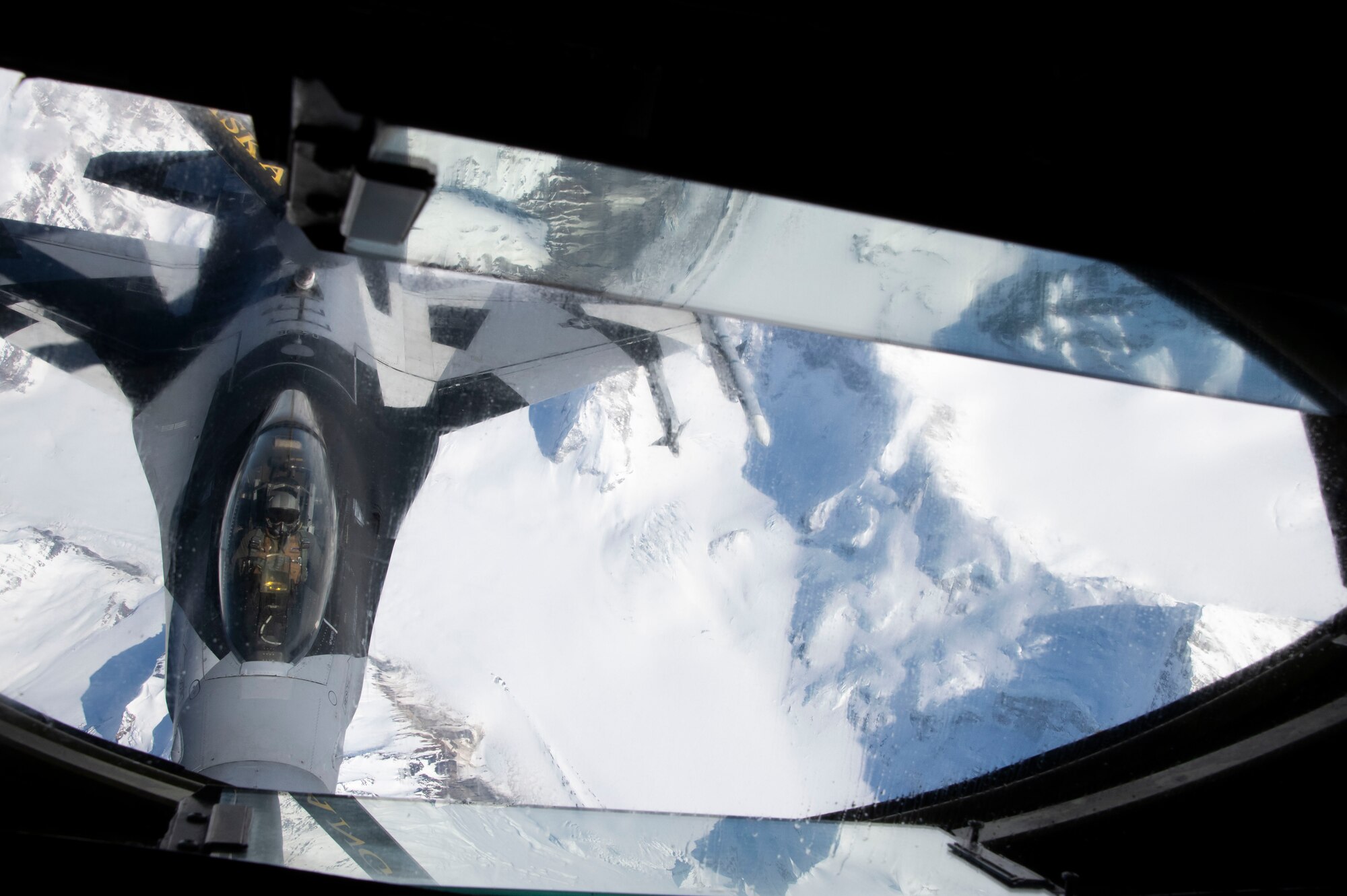 A KC-135 Stratotanker crew with the 168th Wing, Alaska Air National Guard, conducts an aerial refueling mission during Red Flag Alaska 24-1 in the Joint Pacific Alaska Range Complex near Eielson Air Force Base, Alaska.