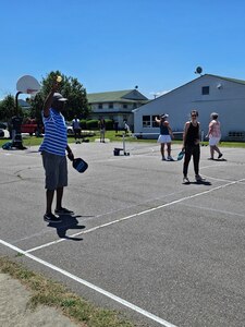 People playing pickleball