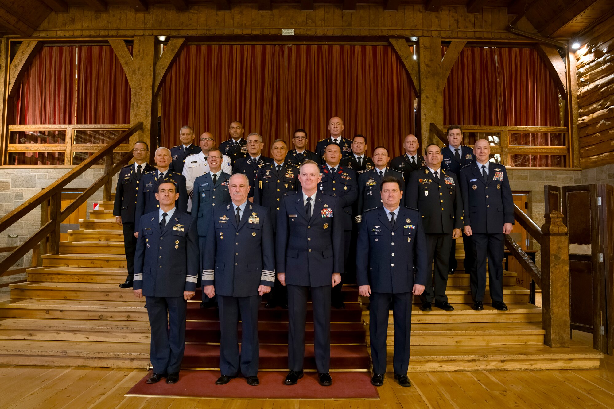 Air Chiefs and representatives from 19 nations across the Western Hemisphere pose for a group photo during the 64th Conference of the American Air Chiefs meeting in San Carlos de Bariloche, Argentina, June 18, 2024. The annual meeting is held to promote and strengthen the bonds of friendship, cooperation and mutual support among its members across the Western Hemisphere. (U.S. Air Force photo by Tech. Sgt. Rachel Maxwell)