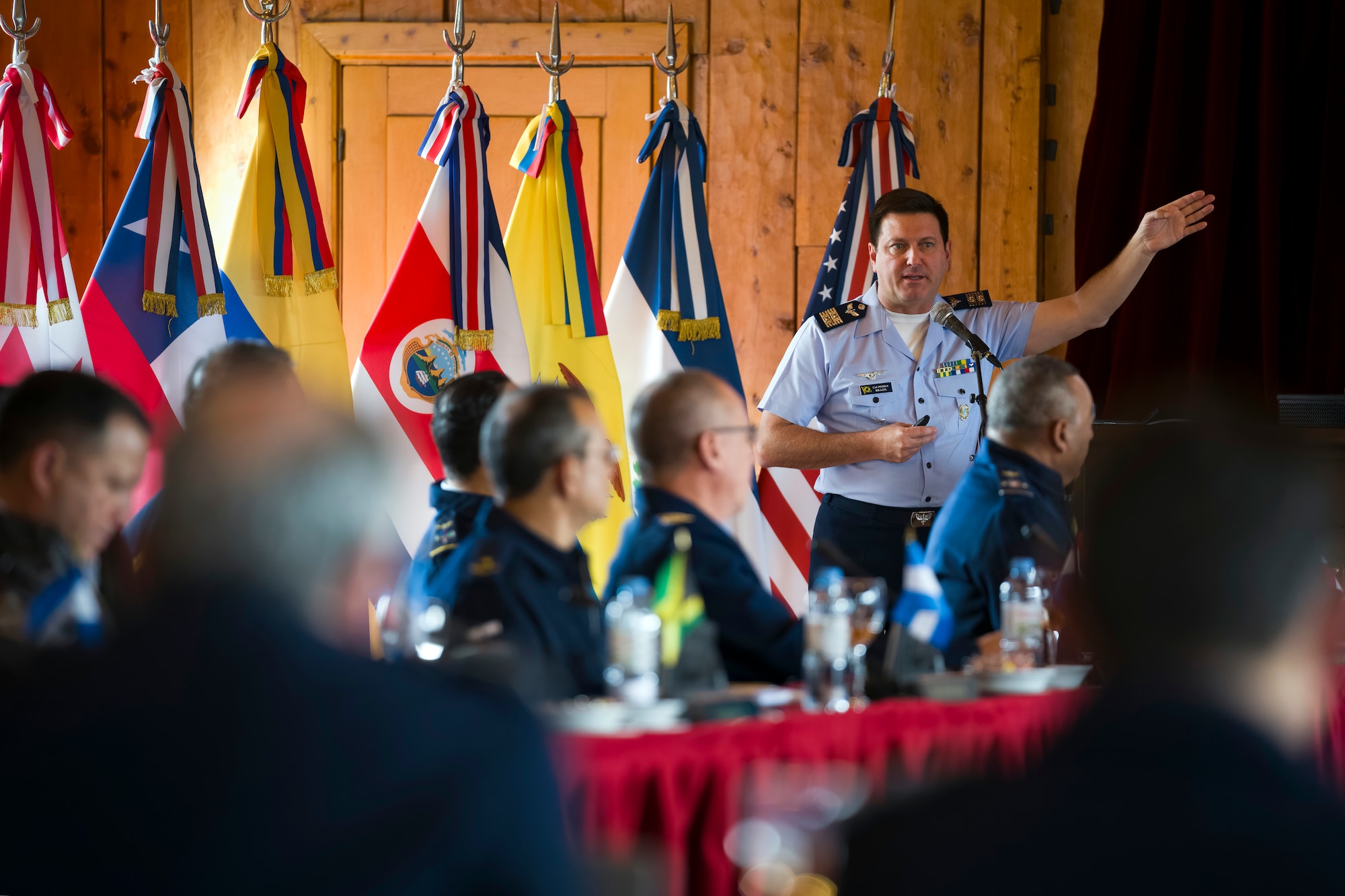 Brazilian Air Force Col. Bruno Pedra, undersecretary general for the Systems of Cooperation Among the American Air Forces, conducts a briefing during the 64th Conference of the American Air Chiefs meeting in San Carlos de Bariloche, Argentina, June 18, 2024. The 3-day conference was sponsored by SICOFAA, an apolitical institution established in 1961, with a purpose to be an efficient organization in cooperation and mutual support between the American air forces and their equivalents. (U.S. Air Force photo by Tech. Sgt. Rachel Maxwell)
