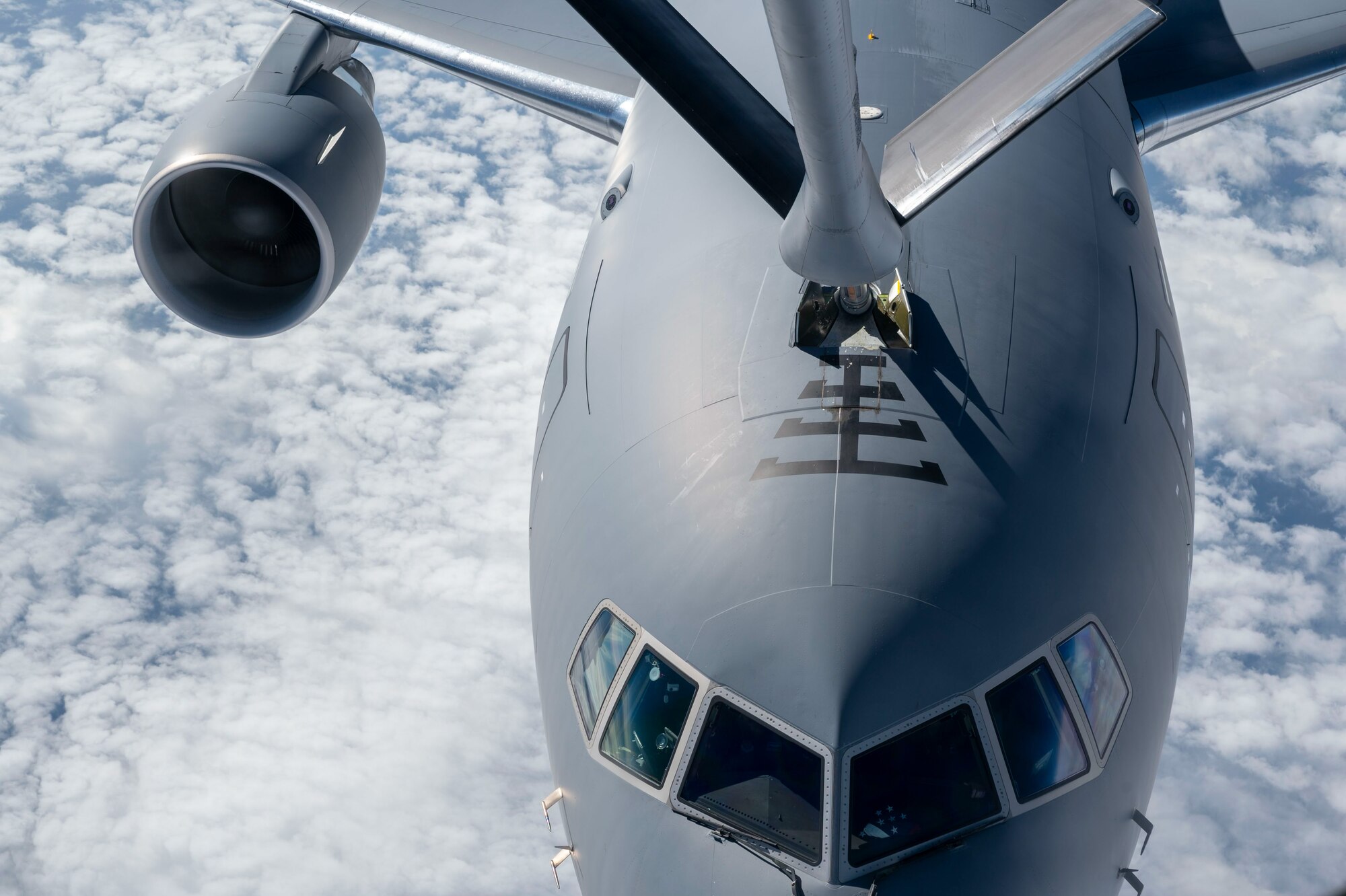 A 350th Air Refueling Squadron KC-135R Stratotanker from McConnell Air Force Base, Kansas, refuels a McConnell KC-46A Pegasus over the United Kingdom, July 1, 2024. The KC-46 was taking part in a 45-hour Maximum Endurance Operation, called Project Magellan, launching June 29 from McConnell Air Force Base, flying westward, non-stop, around the world and landing back at McConnell July 1.  (U.S. Air Force photo by Airman 1st Class Gavin Hameed)