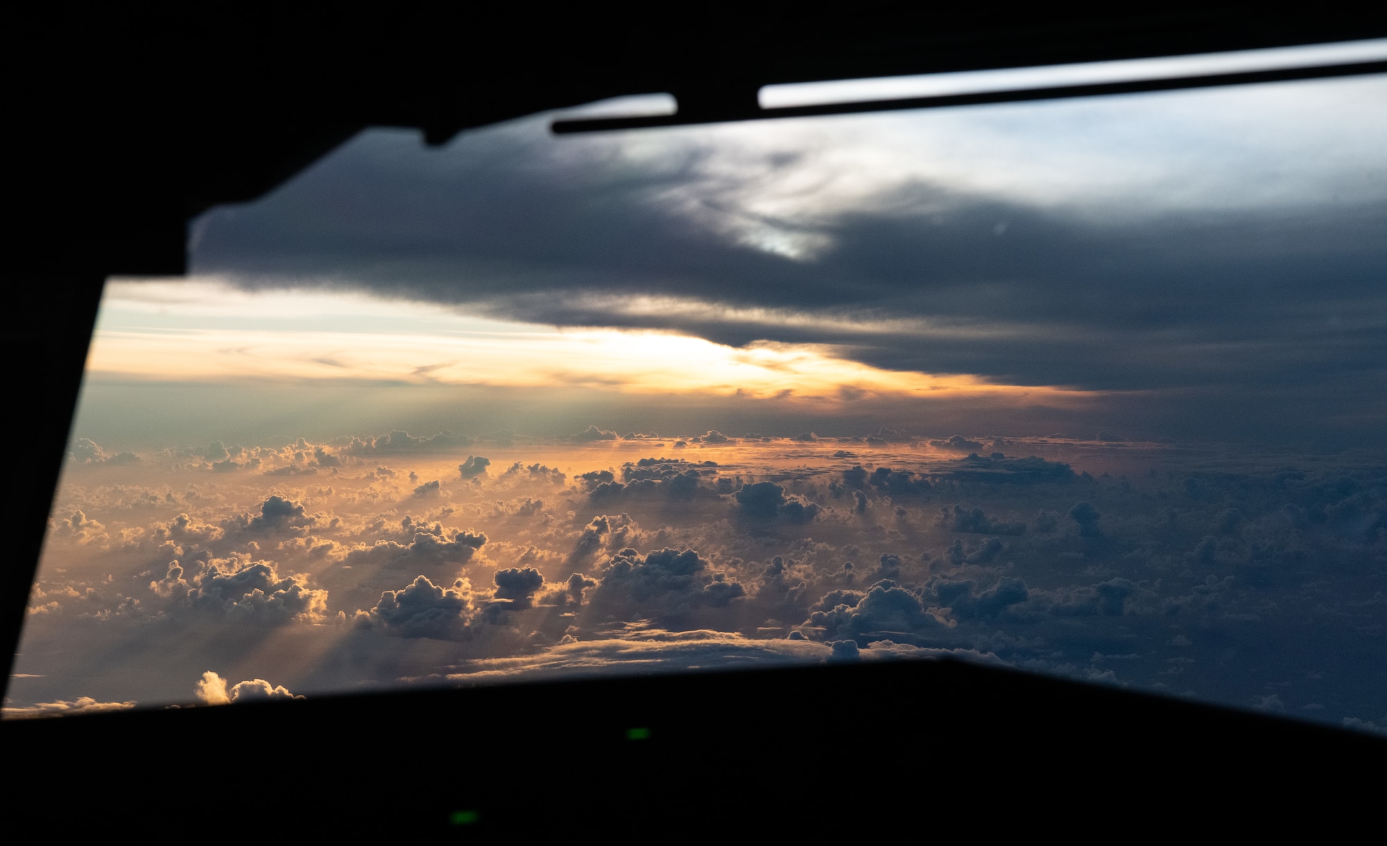 The sun shines on clouds outside of a KC-46A Pegasus from McConnell Air Force Base, Kansas, that is participating in a Maximum Endurance Flight around the globe called Project Magellan June 30, 2024. Magellan was the world’s first nonstop, KC-46 westbound circumnavigation endurance flight that took off from McConnell June 29 and landed again July 1. (Courtesy Photo)