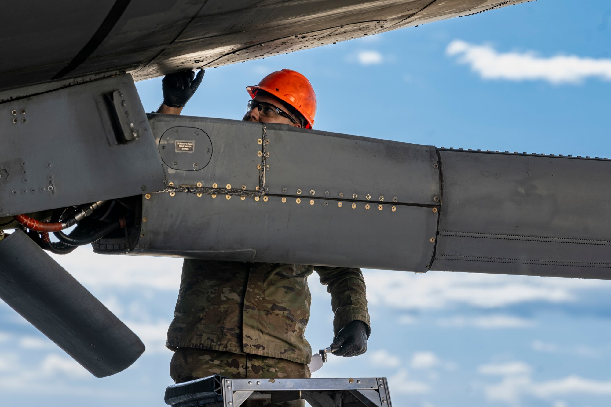 Airman checks the boom of a KC-10 Extender