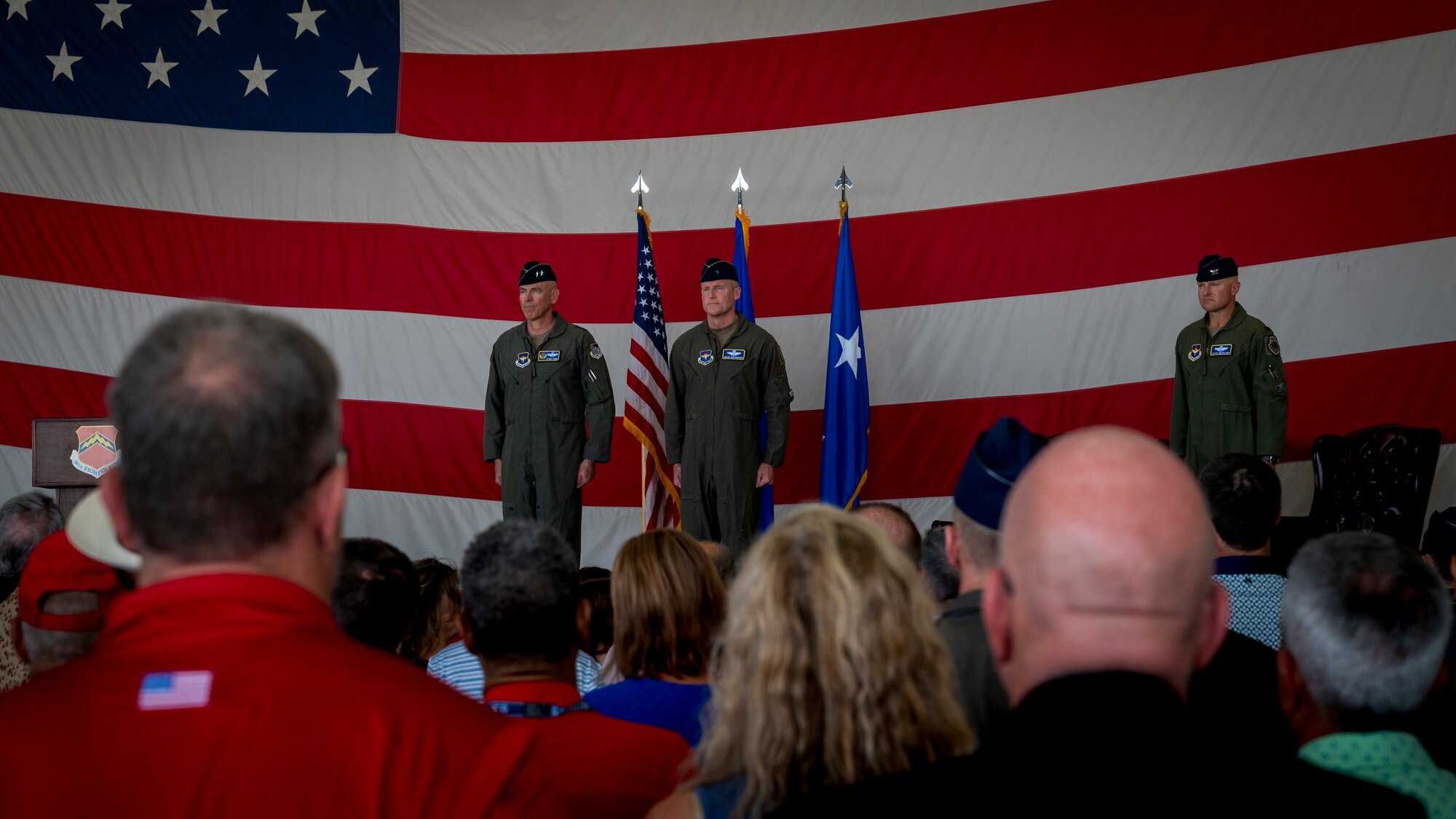 U.S. Air Force Maj. Gen. Clark J. Quinn (center left), 19th Air Force commander, stands next to Brig. Gen. Jason Rueschhoff (center right), 56th Fighter Wing outgoing commander, before transferring command of the 56th FW to Col. David Berkland at the 56th FW Change of Command ceremony, July 1, 2024, at Luke Air Force Base, Arizona.
