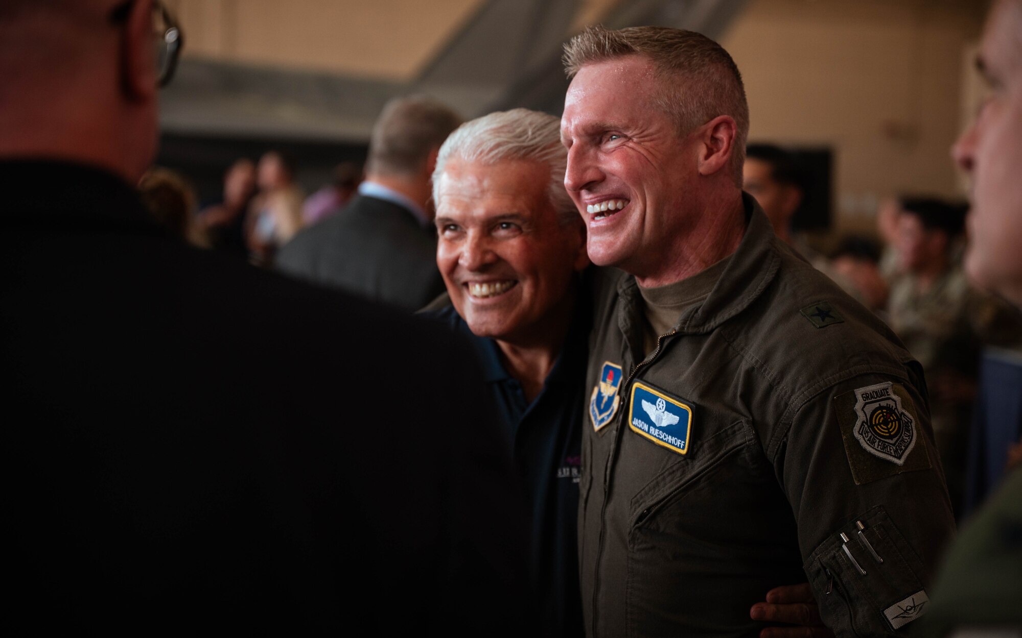 U.S. Air Force Brig. Gen. Jason Rueschhoff (right), 56th Fighter Wing outgoing commander, visits with community partners before transferring command of the 56th FW to Col. David Berkland at the 56th FW Change of Command ceremony, July 1, 2024, at Luke Air Force Base, Arizona.