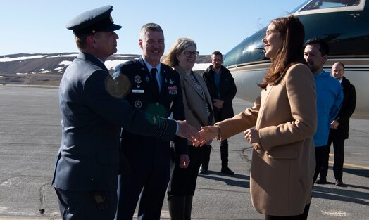  Danish Lt. Col. Lars Hawaleschka Madsen, Danish Liaison Officer to the 821st Space Base Group, left, shakes the hand of Queen Mary, Queen of the Kingdom of Denmark, right, after her arrival to Pituffik Space Base, Greenland, June 29, 2024. King Frederik X and wife Queen Mary acceded to the throne of the Kingdom of Denmark January 14, 2024. (U.S. Space Force photo by 1st Lt. Danielle Rose)