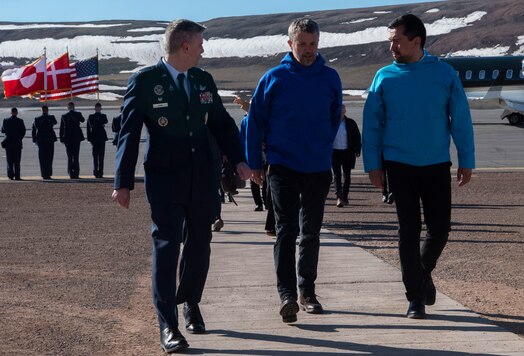  From the left, U.S. Space Force Col. Jason Terry, 821st Space Base Group commander, King Frederik X, King of the Kingdom of Denmark, and Múte Bourup Egede, Prime Minister of Greenland, enjoy a discussion on their way inside after King Frederik X’s arrival to Pituffik Space Base, Greenland. June 29, 2024. King Frederik X made a stop to Pituffik SB while on his way to the village of Qaanaaq. (U.S. Space Force photo by 1st Lt. Danielle Rose)