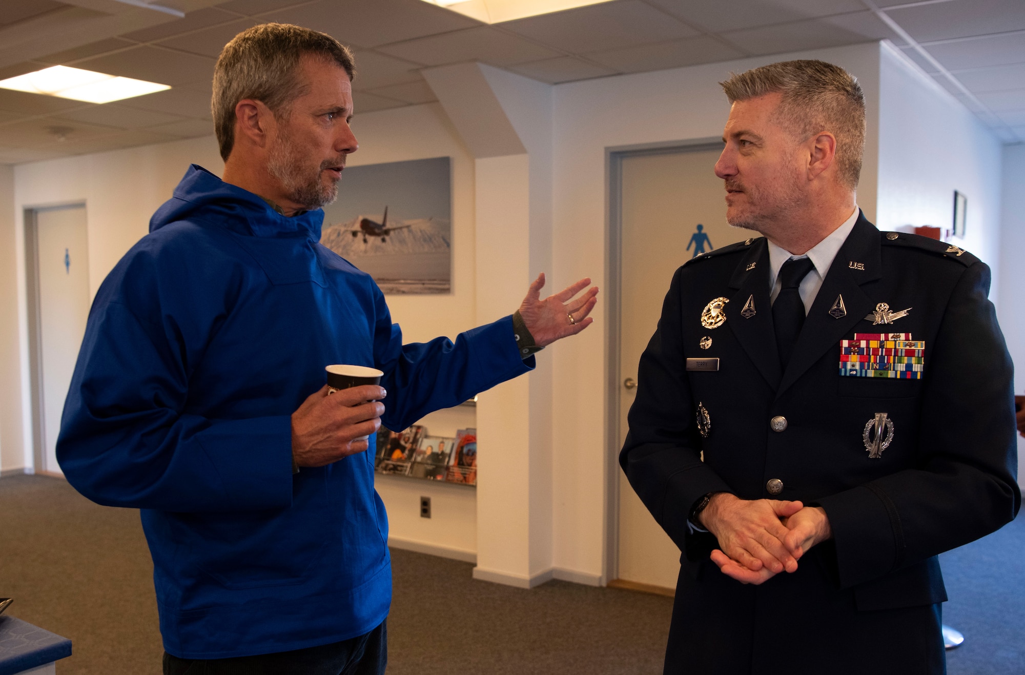 King Frederik X, King of the Kingdom of Denmark, left, has a discussion with U.S. Space Force Col. Jason Terry, 821st Space Base Group commander, right, after his arrival to Pituffik Space Base, Greenland, June 29, 2024. King Frederik X made a stop to Pituffik SB while on his way to the village of Qaanaaq. (U.S. Space Force photo by 1st Lt. Danielle Rose)