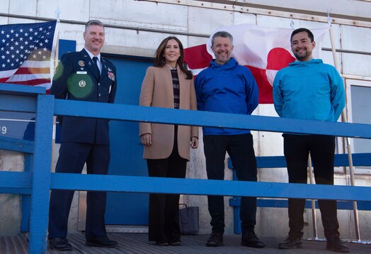  From the left, U.S. Space Force Col. Jason Terry, 821st Space Base Group commander, Queen Mary, Queen of the Kingdom of Denmark, King Frederik X, King of the Kingdom of Denmark, and Múte Bourup Egede, Prime Minister of Greenland smile at Greenlanders and Pituffik Space Base personnel at Pituffik SB, Greenland, June 29, 2024. King Frederik X and wife Queen Mary made a stop to Pituffik SB while on their way to the village of Qaanaaq. (U.S. Space Force photo by 1st Lt. Danielle Rose)