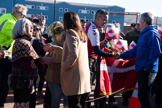  Queen Mary, Queen of the Kingdom of Denmark, left, and King Frederik X, King of the Kingdom of Denmark, right, shake hands with Greenlanders and Pituffik Space Base personnel at Pituffik SB, Greenland, June 29, 2024. King Frederik X and wife Queen Mary made a stop to Pituffik SB while on their way to the village of Qaanaaq. (U.S. Space Force photo by 1st Lt. Danielle Rose)
