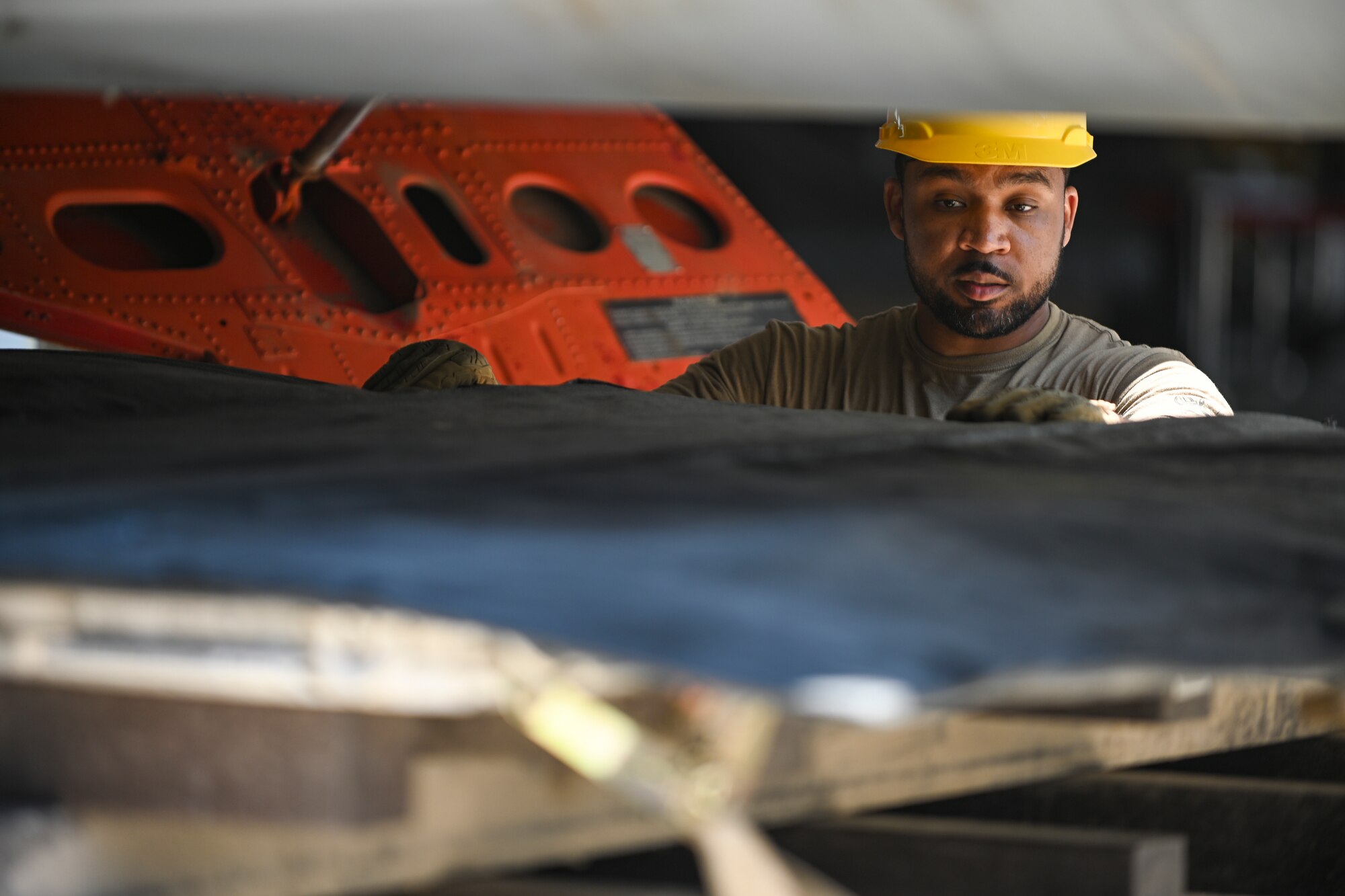 Airman places cover on platform