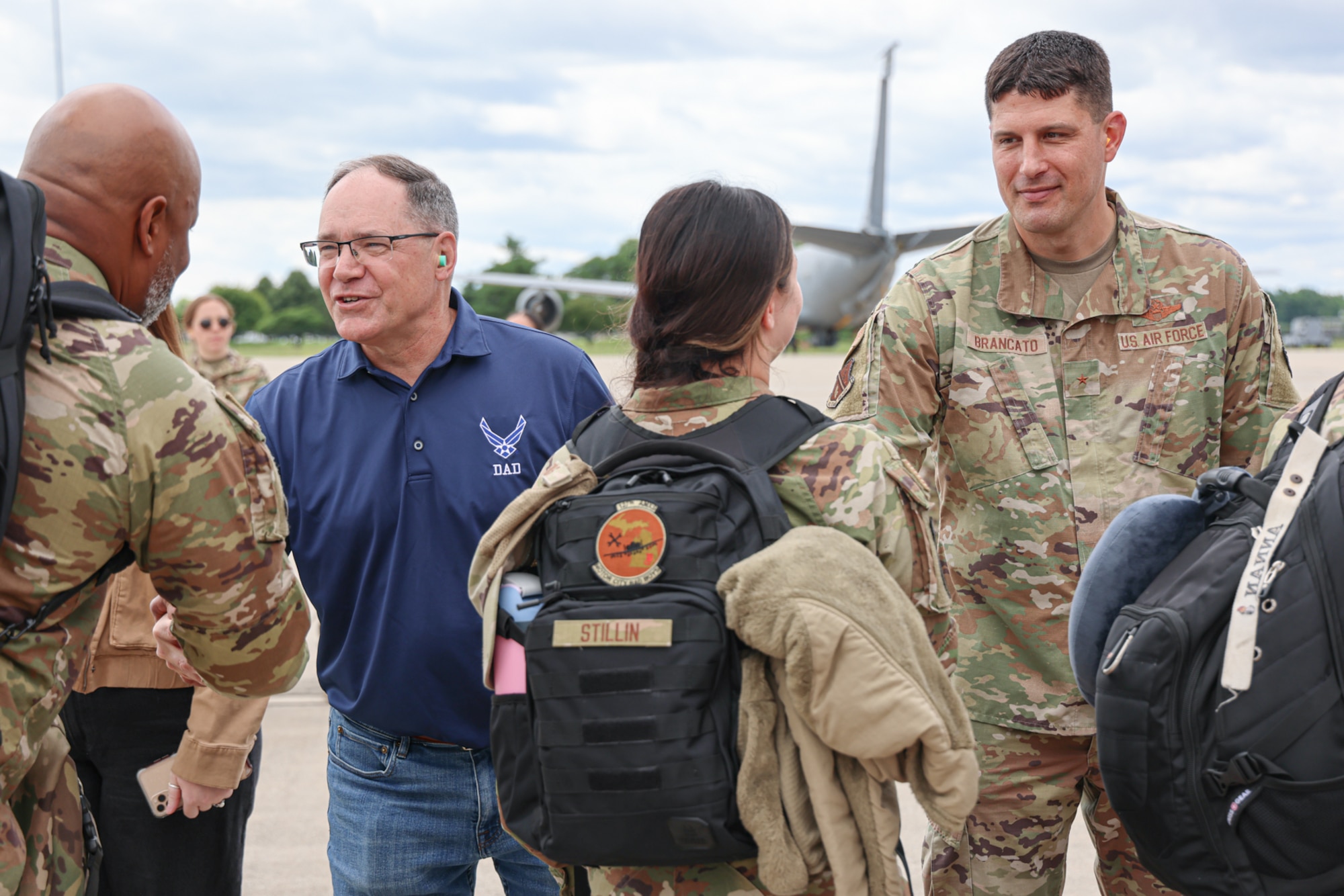 U.S. Army Maj. Gen. Paul Rogers, adjutant general of the Michigan National Guard, left, and U.S. Air Force Brig. Gen. Matthew Brancato, 127th Wing commander, say goodbye to deploying Airmen at Selfridge Air National Guard Base,