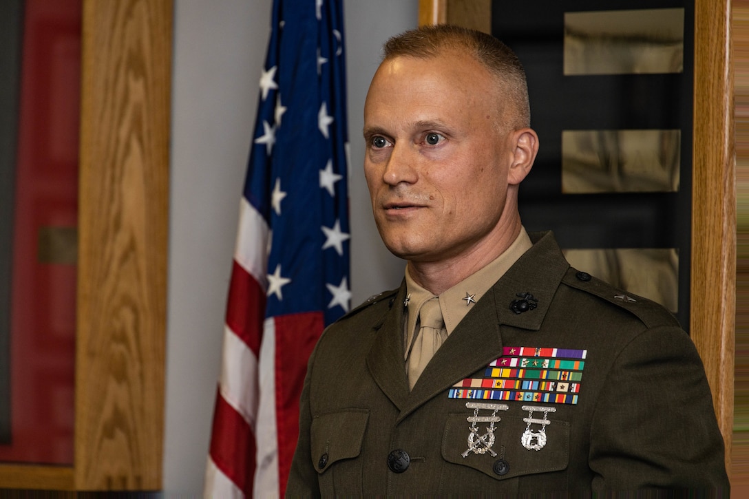 U.S. Marine Corps Col. James W. Lively, the assistant division commander of 2d Marine Division, gives remarks to colleagues, family, and friends during his frocking ceremony on Marine Corps Base Camp Lejeune, North Carolina, June 30, 2024. Frocking is a tradition where Marines are advanced to the next pay grade, assuming the title and the responsibilities prior to their official date of promotion. Lively was frocked to the rank of brigadier general. (U.S. Marine Corps photo by Sgt. Alexa M. Hernandez)