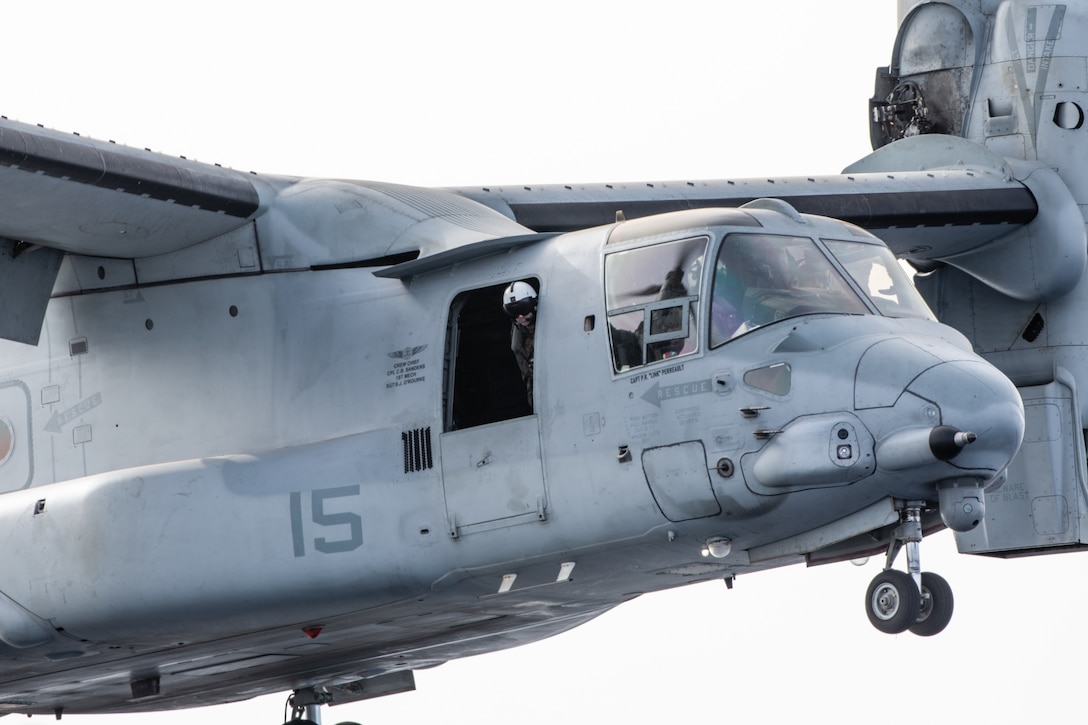 U.S. Marines and British Royal Navy Lt. Cmdr. Barry Barkey with Marine Medium Tiltrotor Squadron 365 (Reinforced), 24th Marine Expeditionary Unit (MEU) Special Operations Capable (SOC), prepare to land a MV-22B Osprey tiltrotor aircraft on the amphibious assault ship USS Wasp (LHD 1) during routine flight operations while underway in the Mediterranean Sea, June 28, 2024. The Wasp Amphibious Ready Group-24th MEU (SOC) is conducting operations in U.S. Naval Forces Europe area of operations to support high-end warfighting exercises while demonstrating speed and agility operating in a dynamic security environment. (U.S. Marine Corps photo by Gunnery Sgt. Hector de Jesus)