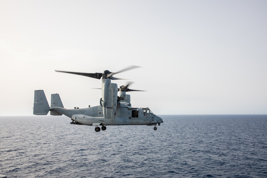 A U.S. Marine Corps MV-22B Osprey tiltrotor aircraft with Marine Medium Tiltrotor Squadron 365 (Reinforced), 24th Marine Expeditionary Unit (MEU) Special Operations Capable (SOC), flies by the amphibious assault ship USS Wasp (LHD 1) during routine flight operations while underway in the Mediterranean Sea, June 28, 2024. The Wasp Amphibious Ready Group-24th MEU (SOC) is conducting operations in U.S. Naval Forces Europe area of operations to support high-end warfighting exercises while demonstrating speed and agility operating in a dynamic security environment. (U.S. Marine Corps photo by Gunnery Sgt. Hector de Jesus)