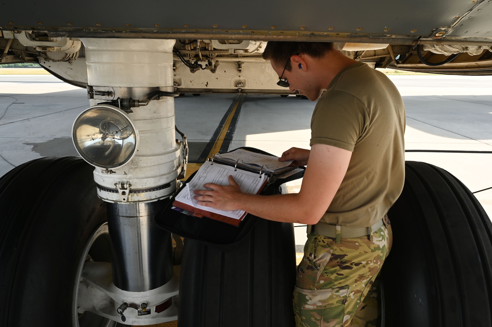 Engineer inspects maintenance forms