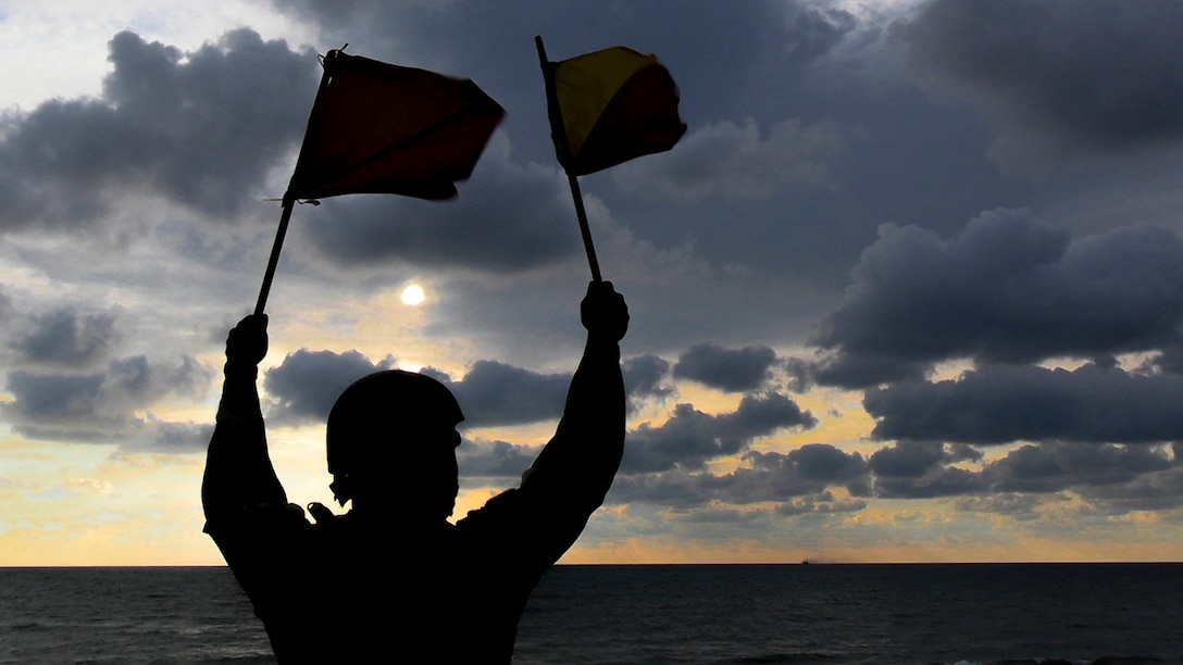 A U.S. Navy Sailor with Beach Master Unit 4, USS New York (LPD 21), Wasp Amphibious Ready Group-24th Marine Expeditionary Unit Special Operations Capable, guides a landing craft, air cushion conducting ship-to-shore movements during Baltic Operations (BALTOPS) 24 in Ventspils, Latvia, June 7, 2024. BALTOPS 24 is the premier maritime-focused exercise in the Baltic Region. The exercise, led by U.S. Naval Forces Europe-Africa and executed by Naval Striking and Support Forces NATO, provides a unique training opportunity to strengthen combined response capabilities critical to preserving freedom of navigation and security in the Baltic Sea. (U.S. Marine Corps photo by Cpl. Victoria Hutt)