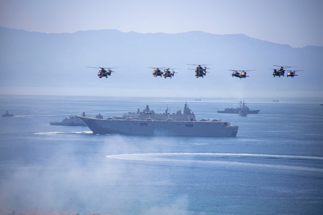 U.S. Marine Corps Brig. Gen. Samuel L. Meyer, the commanding general of Task Force 61/2 (TF 61/2) observes helicopters and ships during exercise EFES 2024 in Izmir, Turkiye, May 30, 2024. Exercise EFES 2024 is an international Combined Joint Live-Fire Exercise focused on increasing force readiness, promoting stability and prosperity in the region, and interoperability between the U.S., Turkey, and a total of 49 allied nations including 11,000 involved military personnel. TF 61/2 is a forward-deployed command element in support of U.S. Sixth Fleet operations in the U.S. European Command and U.S. Africa Command, and is deployed in the U.S. Naval Forces Europe area of operations, employed by U.S. Sixth Fleet to support U.S. allied and partner interests. (U.S. Marine Corps photo by Cpl. Marc Imprevert)