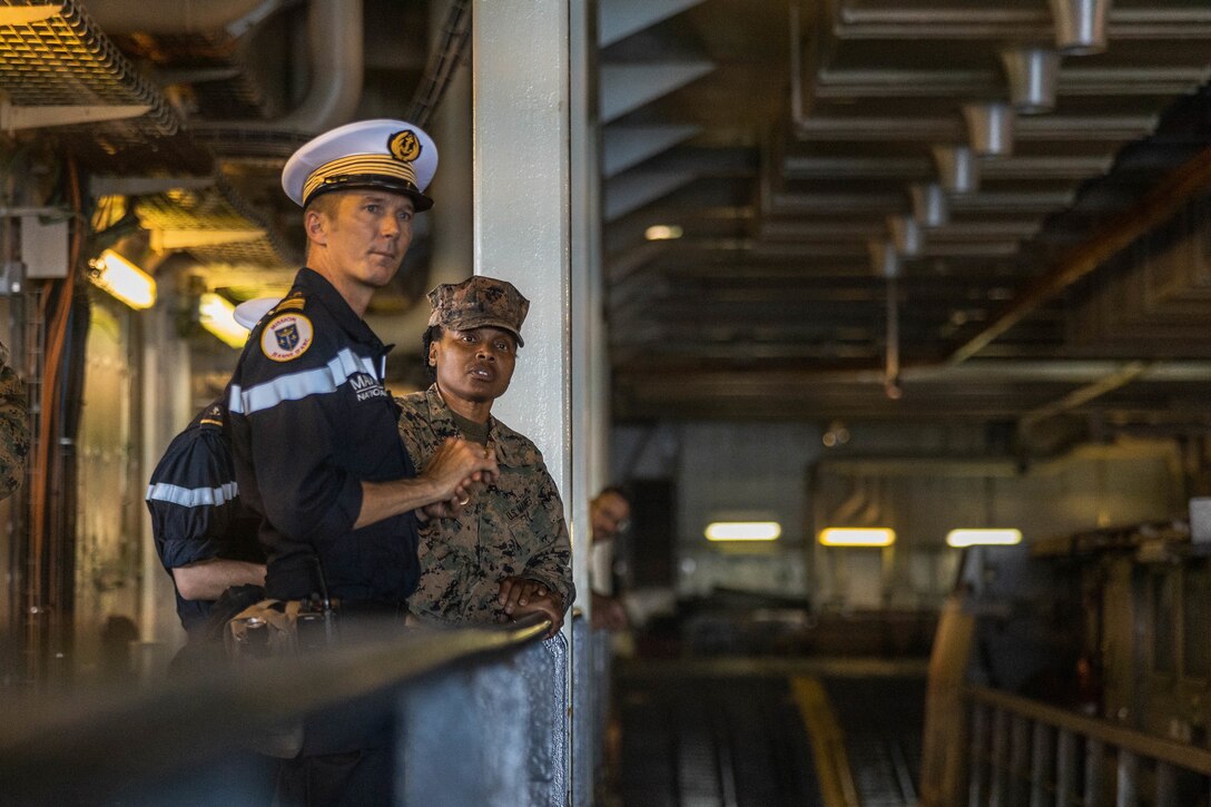 French Marine Nationale Captain of the FS Tonnerre (L 9014), speaks about the capabilities of the FS Tonnerre (L 9014) with U.S. Marine Corps Col. Melissa Chestnut, commanding officer, Combat Logistics Regiment 27, 2nd Marine Logistics Group, during Jeanne D’Arc 24 Amphibious Exercise on Camp Lejeune, North Carolina, June 13, 2024. Jeanne D’Arc 24 AMPHIBEX increases 2nd MLG joint interoperability and enhance readiness by employing forces to conduct joint and international training objectives to enhance battlefield relationships. (U.S. Marine Corps photo by Cpl. Alfonso Livrieri)